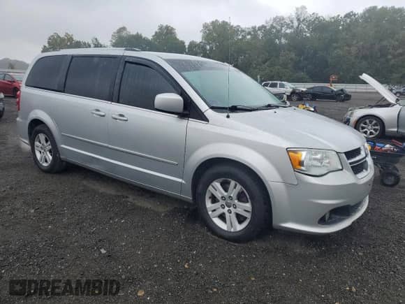 2012 Dodge Grand Caravan Crew with VIN 2C4RDGDGXCR377702, listed as a Copart auction lot 71827965 with 221,594 mi miles and Salvage title. Bid and sale history available at DreamBid. Image 4.