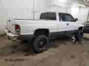 2000 Dodge 1500 z VIN 3B7HF12Z7YG161262, wystawiony jako Copart lot #43696945 z przebiegiem 143 767 mil mil oraz Szkoda całkowita • Salvage title. Historia ofert i sprzedaży dostępna na DreamBid. Obrazek 3.
