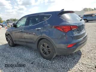 2017 Hyundai Santa Fe 2.4L z VIN 5XYZTDLB6HG441771, wystawiony jako Copart lot #81745675 z przebiegiem 136 514 mil mil oraz Szkoda całkowita • Salvage title. Historia ofert i sprzedaży dostępna na DreamBid. Obrazek 2.