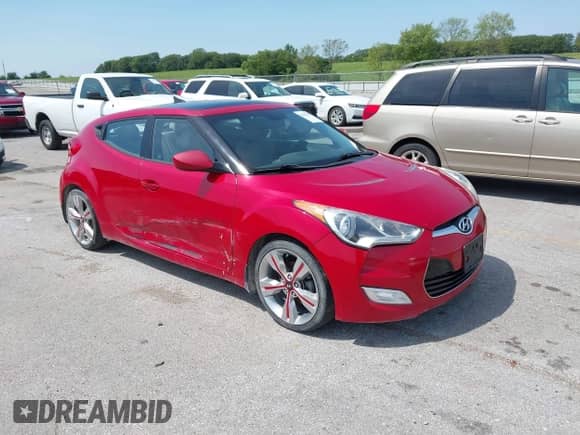 2013 Hyundai Veloster w/Black Int z VIN KMHTC6AD2DU146306, wystawiony jako IAAI lot #42943659 z przebiegiem 125 817 mil mil oraz . Historia ofert i sprzedaży dostępna na DreamBid. Obrazek 1.