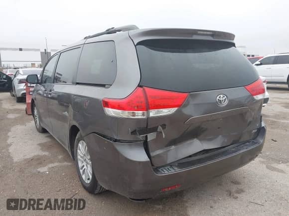 2013 Toyota Sienna XLE AAS with VIN 5TDYK3DCXDS302031, listed as a IAAI auction lot 43111515 with 168,838 mi miles and . Bid and sale history available at DreamBid. Image 3.