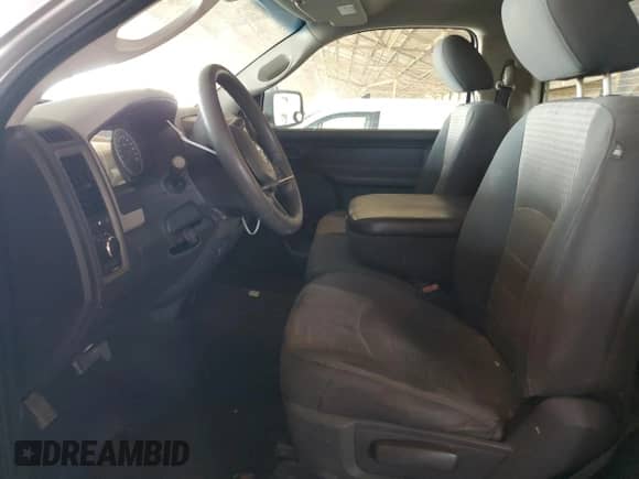 2012 Ram 1500 ST with VIN 3C6JD6AKXCG179330, listed as a Copart auction lot 63710844 with 142,010 mi miles and Salvage title. Bid and sale history available at DreamBid. Image 7.
