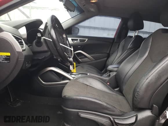 2014 Hyundai Veloster z VIN KMHTC6ADXEU216720, wystawiony jako Copart lot #67971295 z przebiegiem 81 777 mil mil oraz Szkoda całkowita • Salvage title. Historia ofert i sprzedaży dostępna na DreamBid. Obrazek 7.