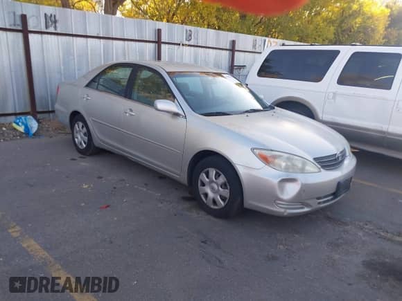 2003 Toyota Camry LE with VIN JTDBE32K130187036, listed as a IAAI auction lot 43504391 with 205,170 mi miles and . Bid and sale history available at DreamBid. Image 1.