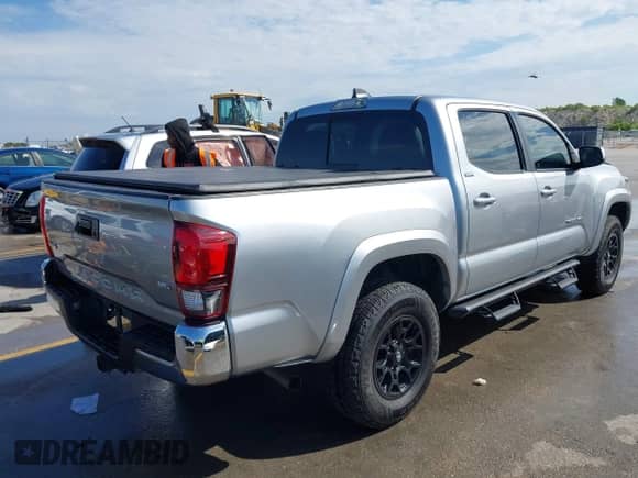 2022 Toyota Tacoma SR5 with VIN 3TMAZ5CN8NM173705, listed as a IAAI auction lot 43084457 with 53,126 mi miles and . Bid and sale history available at DreamBid. Image 4.