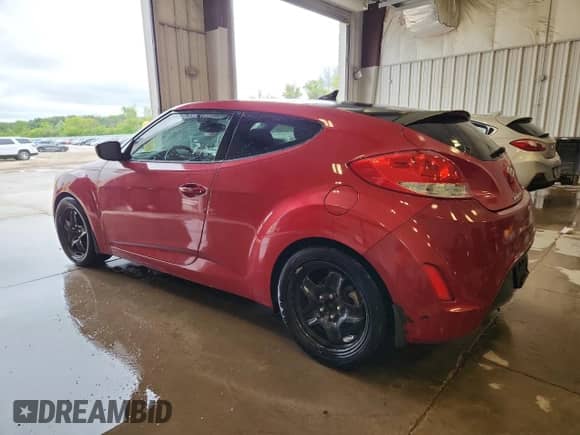 2013 Hyundai Veloster w/Black Int z VIN KMHTC6AD1DU167261, wystawiony jako Copart lot #63744355 z przebiegiem 121 478 mil mil oraz Czysty tytuł • Clean title. Historia ofert i sprzedaży dostępna na DreamBid. Obrazek 2.