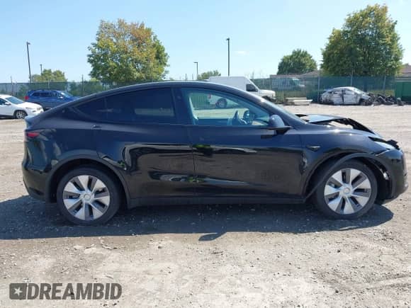 2023 Tesla Model Y Long Range z VIN 7SAYGDEE0PA201841, wystawiony jako IAAI lot #43158634 z przebiegiem 10 356 mil mil oraz . Historia ofert i sprzedaży dostępna na DreamBid. Obrazek 13.