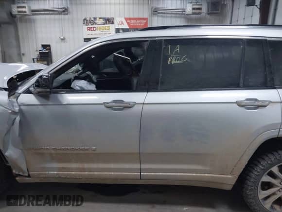 2021 Jeep Grand Cherokee Overland with VIN 1C4RJKDG3M8119823, listed as a IAAI auction lot 42163425 with 54,560 mi miles and . Bid and sale history available at DreamBid. Image 13.