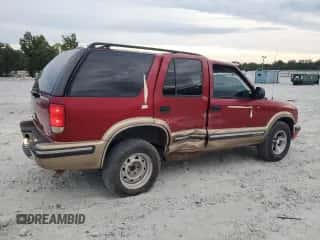 1999 Chevrolet Blazer LS с VIN 1GNCS13WXX2126904, выставлен на аукционе Copart как лот 69987244 с пробегом 384 028 миль миль и Списание • Salvage title. История ставок и продаж доступна на DreamBid. Изображение 3.