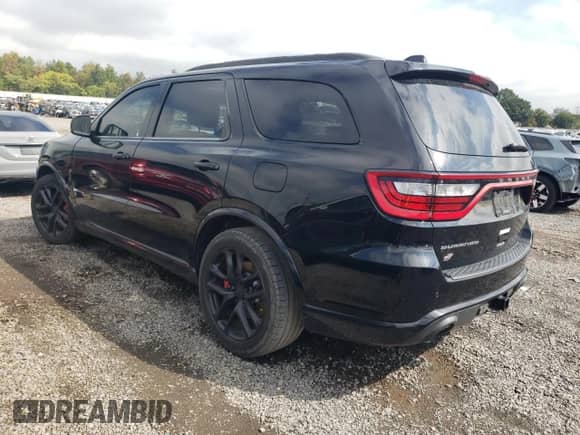 2020 Dodge Durango SRT с VIN 1C4SDJGJ2LC100122, выставлен на аукционе Copart как лот 71490985 с пробегом 77 525 миль миль и Списание • Salvage title. История ставок и продаж доступна на DreamBid. Изображение 2.