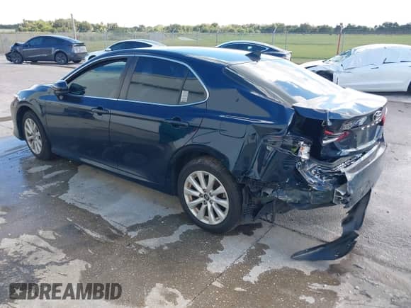 2021 Toyota Camry LE with VIN 4T1C11AK2MU534448, listed as a IAAI auction lot 43111658 with 89,877 mi miles and . Bid and sale history available at DreamBid. Image 3.