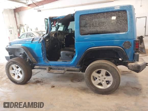 2015 Jeep Wrangler Rubicon Hard Rock z VIN 1C4BJWCG3FL568848, wystawiony jako IAAI lot #42243059 z przebiegiem 60 860 mil mil oraz . Historia ofert i sprzedaży dostępna na DreamBid. Obrazek 14.