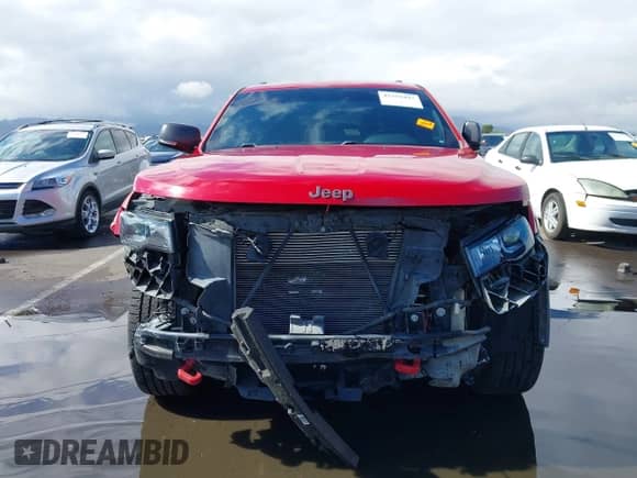 2018 Jeep Grand Cherokee Trailhawk z VIN 1C4RJFLG3JC399051, wystawiony jako IAAI lot #42359437 z przebiegiem 70 956 mil mil oraz . Historia ofert i sprzedaży dostępna na DreamBid. Obrazek 13.