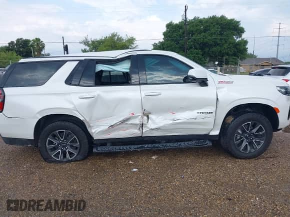 2023 Chevrolet Tahoe Z71 with VIN 1GNSKPKDXPR542392, listed as a IAAI auction lot 42359369 with 31,543 mi miles and . Bid and sale history available at DreamBid. Image 14.