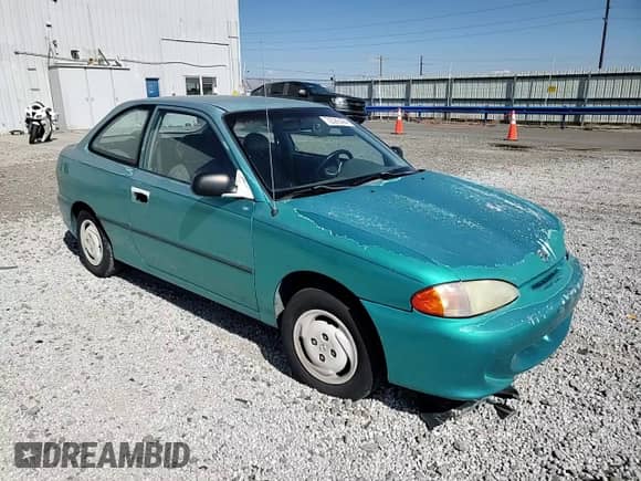 1995 Hyundai Accent z VIN KMHVD14N1SU015961, wystawiony jako Copart lot #72066404 z przebiegiem 118 163 mil mil oraz Szkoda całkowita • Salvage title. Historia ofert i sprzedaży dostępna na DreamBid. Obrazek 10.