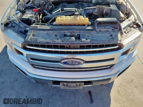 2018 Ford F-150 XLT z VIN 1FTEW1EG2JKE46897, wystawiony jako Copart lot #82422275 z przebiegiem 154 615 mil mil oraz Szkoda całkowita • Salvage title. Historia ofert i sprzedaży dostępna na DreamBid. Obrazek 11.