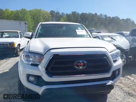 2021 Toyota Tacoma SR5 z VIN 3TYDZ5BN7MT003983, wystawiony jako IAAI lot #42052633 z przebiegiem 60 390 mil mil oraz . Historia ofert i sprzedaży dostępna na DreamBid. Obrazek 12.
