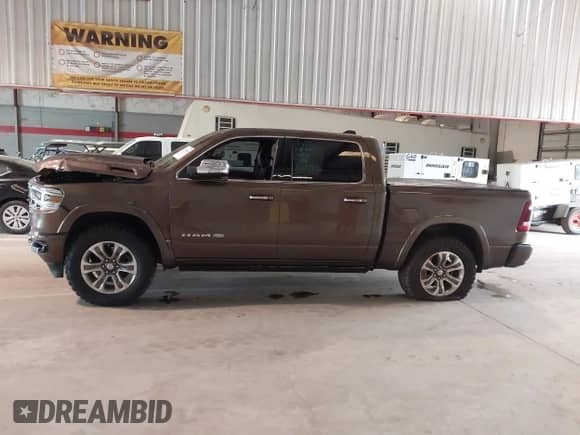 2020 Ram 1500 Longhorn with VIN 1C6SRFKT1LN275397, listed as a IAAI auction lot 42733634 with 101,019 mi miles and . Bid and sale history available at DreamBid. Image 14.