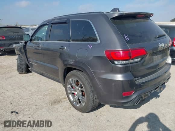 2014 Jeep Grand Cherokee SRT-8 z VIN 1C4RJFDJXEC390248, wystawiony jako IAAI lot #41794995 z przebiegiem 87 881 mil mil oraz . Historia ofert i sprzedaży dostępna na DreamBid. Obrazek 3.
