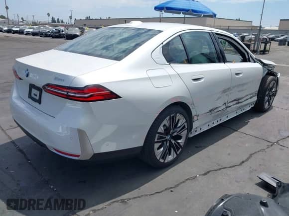 2024 BMW 5 Series 530i with VIN WBA43FJ06RCS61104, listed as a IAAI auction lot 43056084 with Not provided miles and . Bid and sale history available at DreamBid. Image 4.