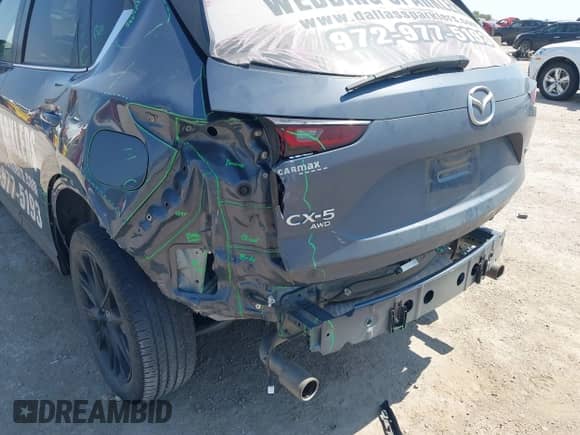 2022 Mazda CX-5 S Preferred with VIN JM3KFBCM9N0529494, listed as a IAAI auction lot 43179890 with 57,495 mi miles and . Bid and sale history available at DreamBid. Image 6.