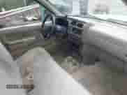 1998 Nissan Frontier XE with VIN 1N6DD21S6WC318243, listed as a IAAI auction lot 42272754 with 201,315 mi miles and . Bid and sale history available at DreamBid. Image 5.