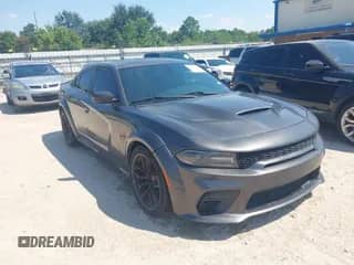 2021 Dodge Charger Scat Pack with VIN 2C3CDXGJ1MH569471, listed as a IAAI auction lot 43132005 with 61,944 mi miles and . Bid and sale history available at DreamBid. Image 1.
