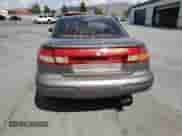 1999 Saturn SC with VIN 1G8ZN1288XZ310351, listed as a Copart auction lot 76677414 with Not provided miles and Salvage title. Bid and sale history available at DreamBid. Image 6.