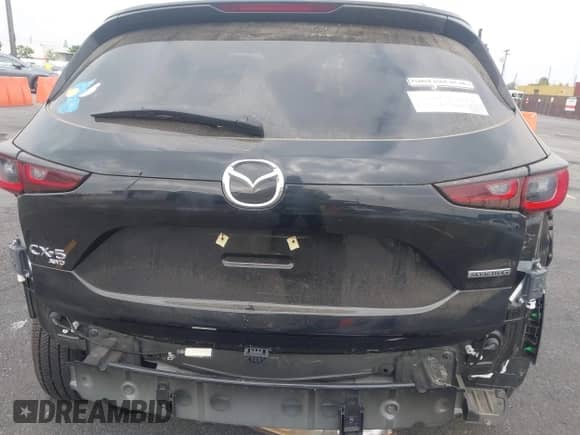 2023 Mazda CX-5 S Carbon Edition z VIN JM3KFBCMXP0132086, wystawiony jako IAAI lot #37026489 z przebiegiem 4 785 mil mil oraz . Historia ofert i sprzedaży dostępna na DreamBid. Obrazek 17.