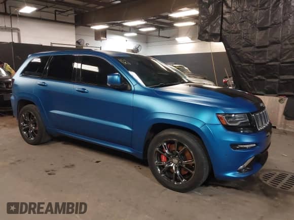2014 Jeep Grand Cherokee SRT-8 z VIN 1C4RJFDJ0EC497826, wystawiony jako IAAI lot #38543666 z przebiegiem 79 937 mil mil oraz . Historia ofert i sprzedaży dostępna na DreamBid. Obrazek 1.