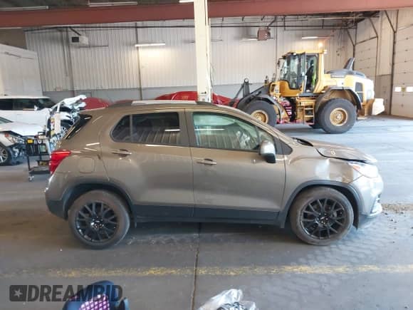 2021 Chevrolet Trax LT z VIN KL7CJLSB8MB358688, wystawiony jako IAAI lot #43028764 z przebiegiem 26 445 mil mil oraz . Historia ofert i sprzedaży dostępna na DreamBid. Obrazek 14.
