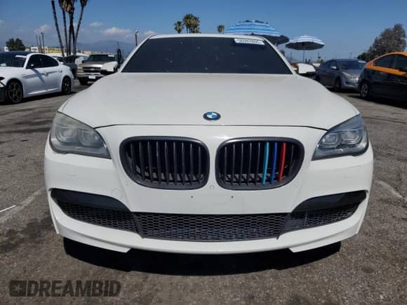 2013 BMW 7 Series 750i with VIN WBAYA8C54DC996412, listed as a Copart auction lot 56982895 with 124,258 mi miles and Salvage title. Bid and sale history available at DreamBid. Image 5.