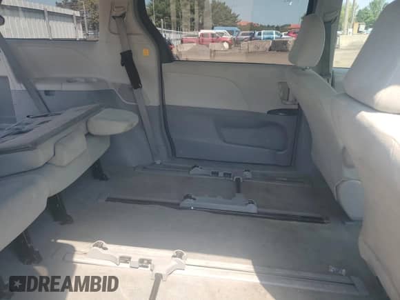 2012 Toyota Sienna with VIN 5TDZK3DC4CS237227, listed as a Copart auction lot 68947005 with 219,993 mi miles and Salvage title. Bid and sale history available at DreamBid. Image 11.
