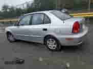 2005 Hyundai Accent GLS z VIN KMHCG45C25U636868, wystawiony jako Copart lot #82320125 z przebiegiem 136 913 mil mil oraz Szkoda całkowita • Salvage title. Historia ofert i sprzedaży dostępna na DreamBid. Obrazek 2.