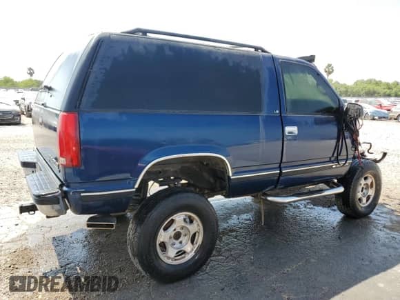 1999 Chevrolet Tahoe with VIN 3GNEK18R0XG193319, listed as a Copart auction lot 53859065 with 164,152 mi miles and Salvage title. Bid and sale history available at DreamBid. Image 3.