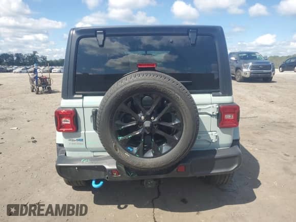 2023 Jeep Wrangler Sahara with VIN 1C4JJXP66PW583248, listed as a Copart auction lot 68308975 with 25,395 mi miles and Salvage title. Bid and sale history available at DreamBid. Image 6.