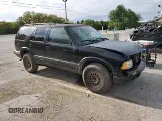 1997 Chevrolet Blazer LS z VIN 1GNDT13W2V2128712, wystawiony jako Copart lot #69841254 z przebiegiem 196 720 mil mil oraz Szkoda całkowita • Salvage title. Historia ofert i sprzedaży dostępna na DreamBid. Obrazek 4.