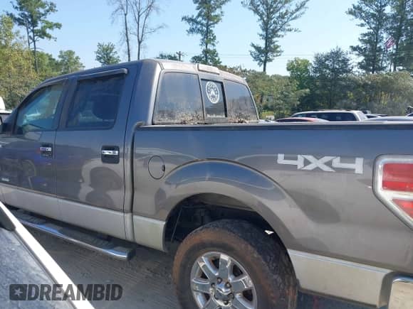 2013 Ford F-150 Lariat with VIN 1FTFW1ET5DFC93463, listed as a IAAI auction lot 43182949 with 133,397 mi miles and . Bid and sale history available at DreamBid. Image 14.