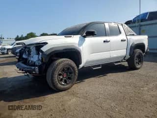 2025 Toyota Tacoma TRD Sport Hybrid with VIN 3TYLC5LN5ST023237, listed as a Copart auction lot 68241635 with 5,512 mi miles and Salvage title. Bid and sale history available at DreamBid. Image 1.