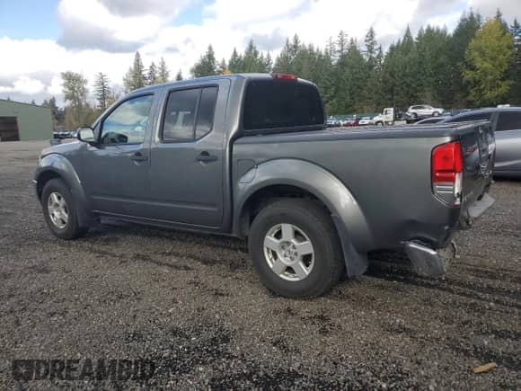 2007 Nissan Frontier LE with VIN 1N6AD07W57C433208, listed as a Copart auction lot 86180195 with 256,124 mi miles and Salvage title. Bid and sale history available at DreamBid. Image 2.