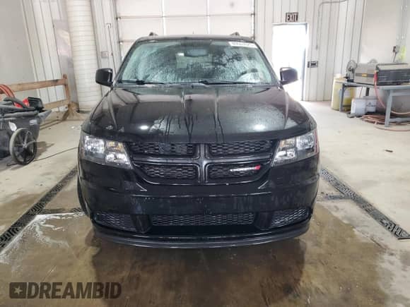 2017 Dodge Journey SE with VIN 3C4PDCAB9HT582022, listed as a Copart auction lot 89663025 with 150,516 mi miles and Salvage title. Bid and sale history available at DreamBid. Image 5.