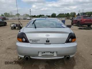 2003 Hyundai Tiburon с VIN KMHHM65D43U017995, выставлен на аукционе Copart как лот 56498665 с пробегом 162 820 миль миль и Списание • Salvage title. История ставок и продаж доступна на DreamBid. Изображение 6.
