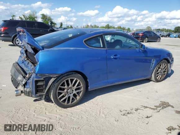 2005 Hyundai Tiburon GS с VIN KMHHM65D55U174910, выставлен на аукционе Copart как лот 72691804 с пробегом 161 764 миль миль и Списание • Salvage title. История ставок и продаж доступна на DreamBid. Изображение 3.