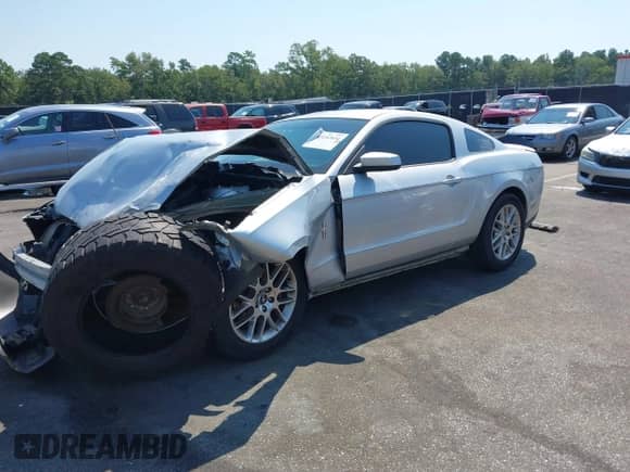2012 Ford Mustang V6 with VIN 1ZVBP8AM7C5220275, listed as a IAAI auction lot 43152834 with 211,238 mi miles and . Bid and sale history available at DreamBid. Image 2.