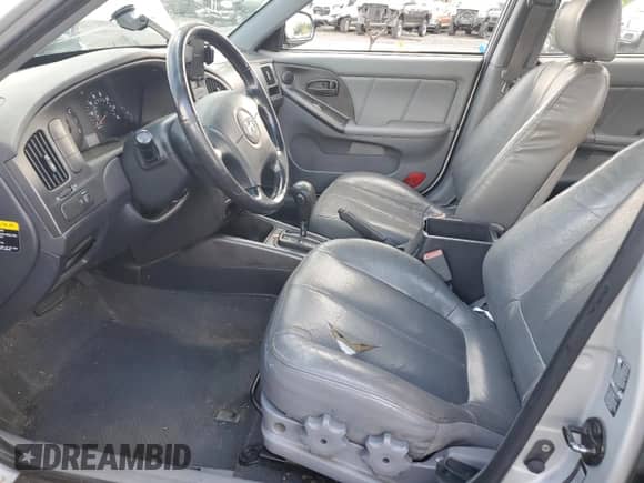 2005 Hyundai Elantra GLS with VIN KMHDN56DX5U147951, listed as a Copart auction lot 64764575 with 221,612 mi miles and Salvage title. Bid and sale history available at DreamBid. Image 7.