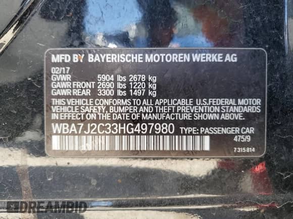 2017 BMW 7 Series 740e xDrive with VIN WBA7J2C33HG497980, listed as a Copart auction lot 50244384 with 115,728 mi miles and . Bid and sale history available at DreamBid. Image 12.