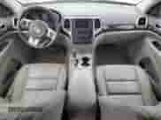 2012 Jeep Grand Cherokee Laredo z VIN 1C4RJFAG0CC156397, wystawiony jako Copart lot #87400775 z przebiegiem 165 192 mil mil oraz Szkoda całkowita • Salvage title. Historia ofert i sprzedaży dostępna na DreamBid. Obrazek 8.