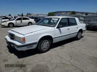 1989 Dodge Dynasty с VIN 1B3BC463XKD594439, выставлен на аукционе Copart как лот 65792195 с пробегом 61 970 миль миль и Чистый • Clean title. История ставок и продаж доступна на DreamBid. Изображение 1.