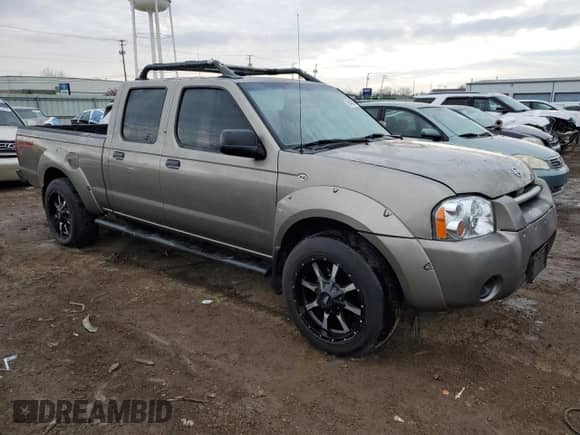 2004 Nissan Frontier XE z VIN 1N6ED29Y54C462070, wystawiony jako Copart lot #85443024 z przebiegiem Nie podano mil oraz Szkoda całkowita • Salvage title. Historia ofert i sprzedaży dostępna na DreamBid. Obrazek 4.