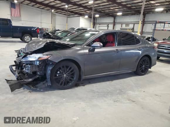 2023 Toyota Camry Hybrid XSE с VIN 4T1K31AK7PU608103, выставлен на аукционе Copart как лот 71901105 с пробегом 65 154 миль миль и Списание • Salvage title. История ставок и продаж доступна на DreamBid. Изображение 1.